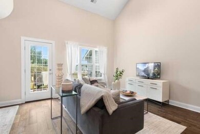 Light & bright living area gives access to back pa