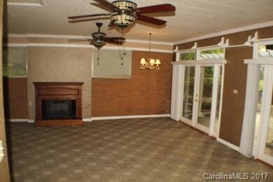 Family room has tremendous space, tons of light, and opens right on to the patio.