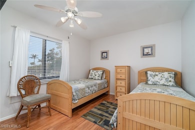 Bedroom featuring ceiling fan and wood-type floori