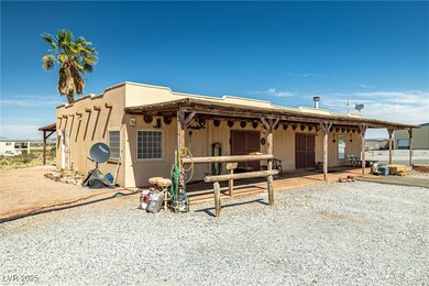 Pueblo revival-style home featuring stucco siding