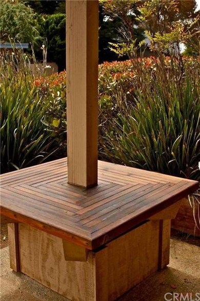 Sitting bench outside front door on first level.
