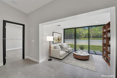 Photo Staged. View of back seating area overlooking the back patio.