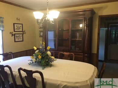Dining room with tile floor, new light fixture