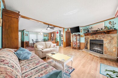 Living room featuring a fireplace, ornamental mold