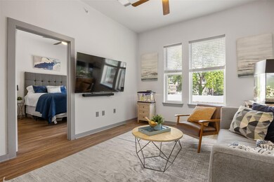 Living area featuring wood finished floors, ceili