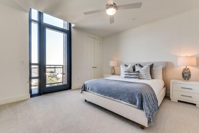 Bedroom featuring baseboards, ceiling fan, light c