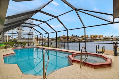 View of swimming pool with an in ground hot tub, a