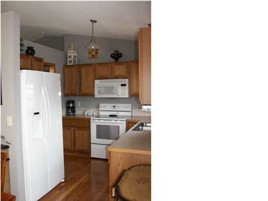 The kitchen has wood floors.