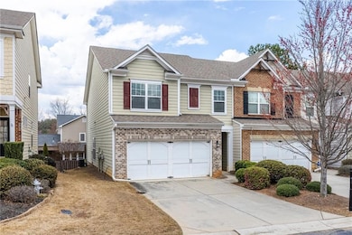 Townhome / multi-family property with brick siding
