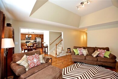 This angle faces towards the entry foyer and shows the openness of this beautiful home.
