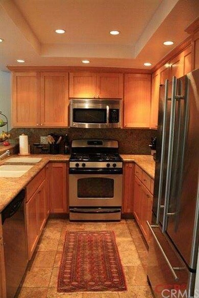 Full view of the updated cabinets, granite counter