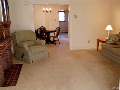 Large living room has tall ceiling.
