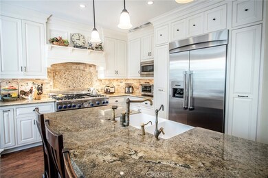 Re-imagined kitchen boasting Alderwood custom cabinetry and gorgeous finishes.