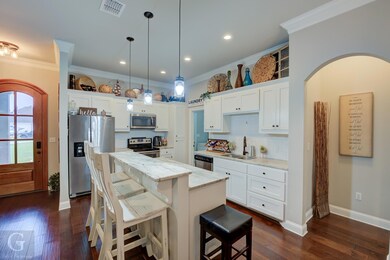 Kitchen with dark hardwood / wood-style floors, st