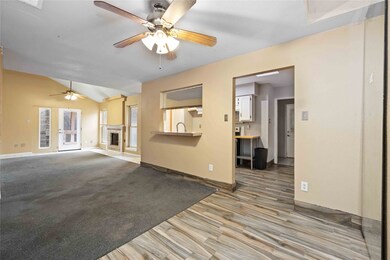 The combination living room and dining room is spa