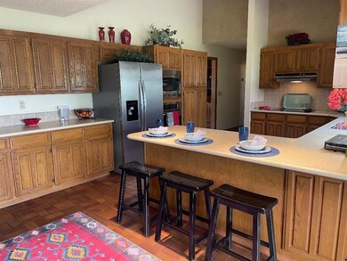 Kitchen featuring a breakfast bar, extractor fan, 