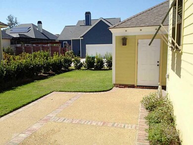 Photo. Rear patio, yard and detached garage. Plent