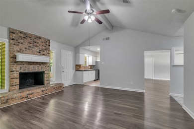 The den/living room and kitchen are connected in a