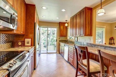 Renovated kitchen with custom cherry cabinets and 