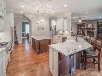 Custom kitchen is open to great room. Huge center 