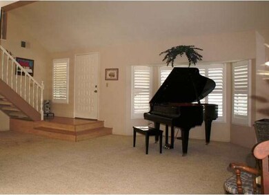 Spacious entry into the dramatic formal living are
