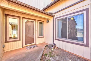 View of exterior entry featuring a patio area