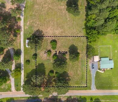 Birds eye view of property featuring a rural view