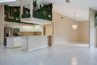 Kitchen with stainless steel appliances, high vaul