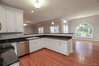 Kitchen with light hardwood / wood-style flooring,