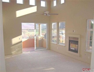 The living room boasts 15 foot ceilings with extra