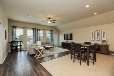 Open breakfast area and den. Tons of light from the floor to ceiling windows!