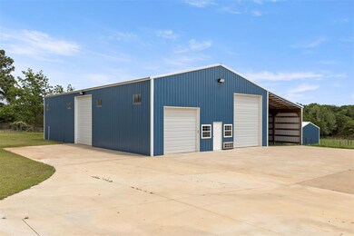 View of shop with an office and an additional barn