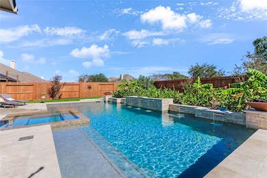 Escape to your own oasis with this stunning custom-designed pool, perfect for relaxation and entertaining.