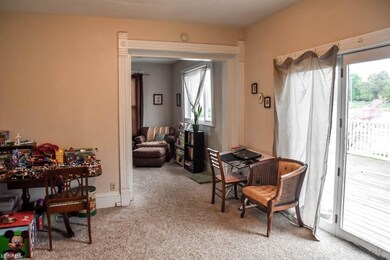 Formal dining room with sliding doors to the deck.