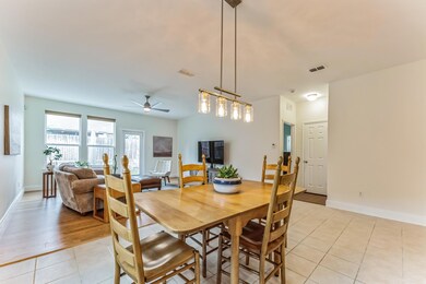 Dining area with light tile patterned floors and c