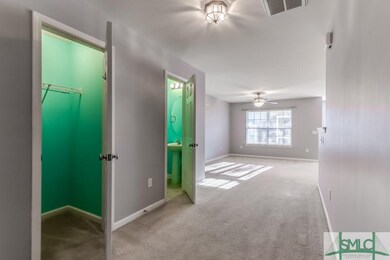Closet and 1/2 bath in entry hallway
