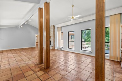 Unfurnished living room featuring lofted ceiling, 