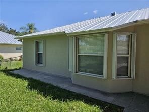 Back yard with Accordion shutters front and back