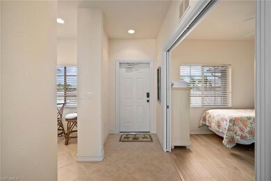 Foyer with light tile flooring