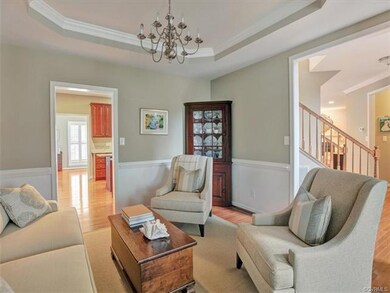 Formal living room with tray ceiling, crown moldin
