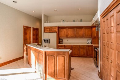 Fully applianced kitchen with marble floors.