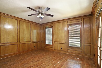 Wood panel and flooring in this beautiful office/study
