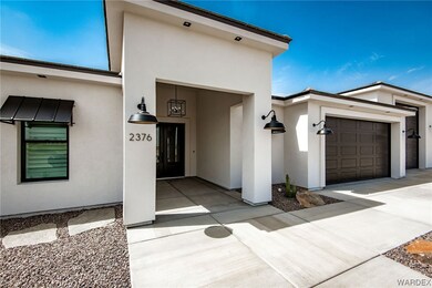 Doorway to property featuring garage