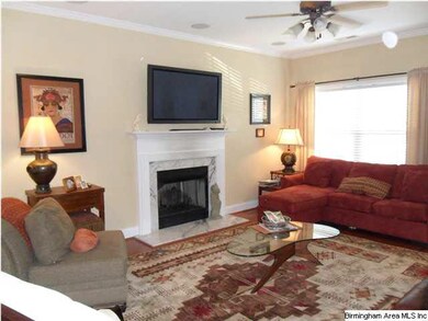 Great room features a gas log fireplace, crown mou