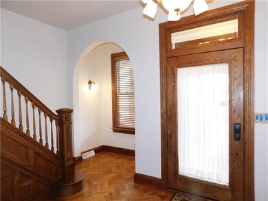 Large entry way show beautiful oak woodwork that y