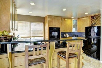 Another view of kitchen with large, corner windows