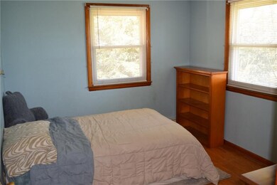 Bedroom 2 with real hardwood flooring