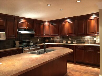 A large kitchen with center island. Great gatherin