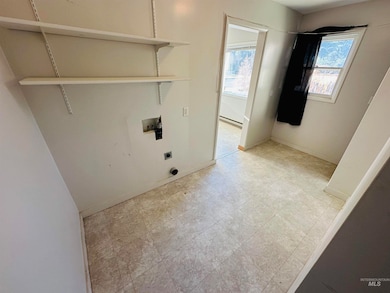 Washroom featuring hookup for a washing machine and electric dryer hookup