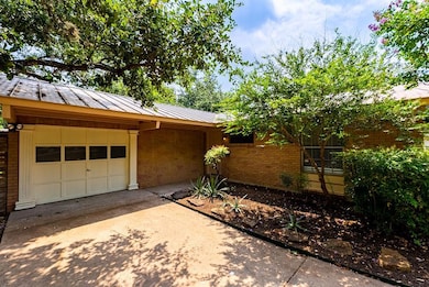 Garage with concrete driveway